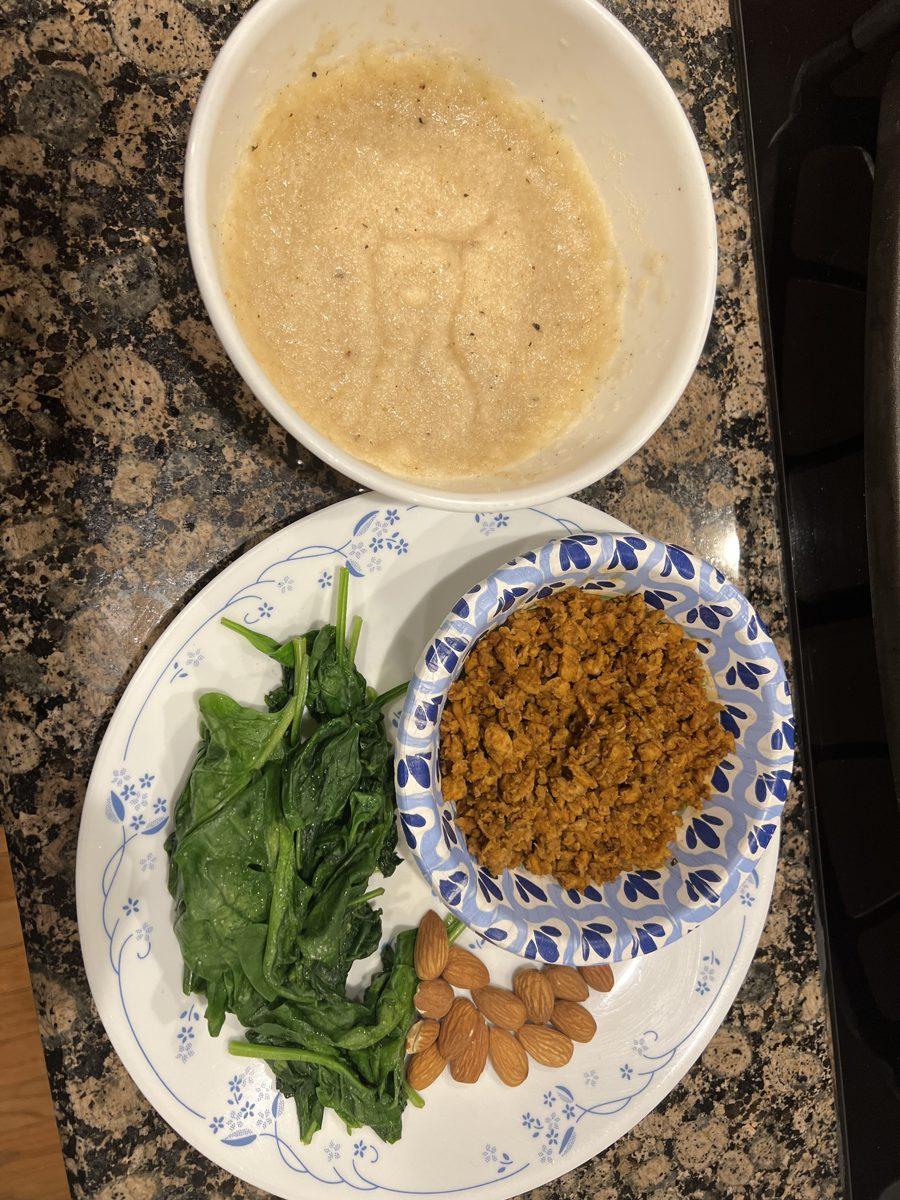 A plated cut meal: spinach, seasoned ground meat, almonds, and a bowl of cream of rice