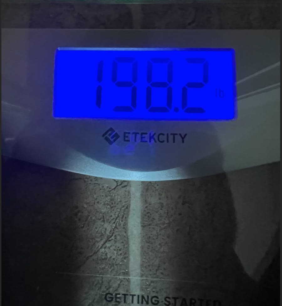 Bathroom scale display reading 198.2